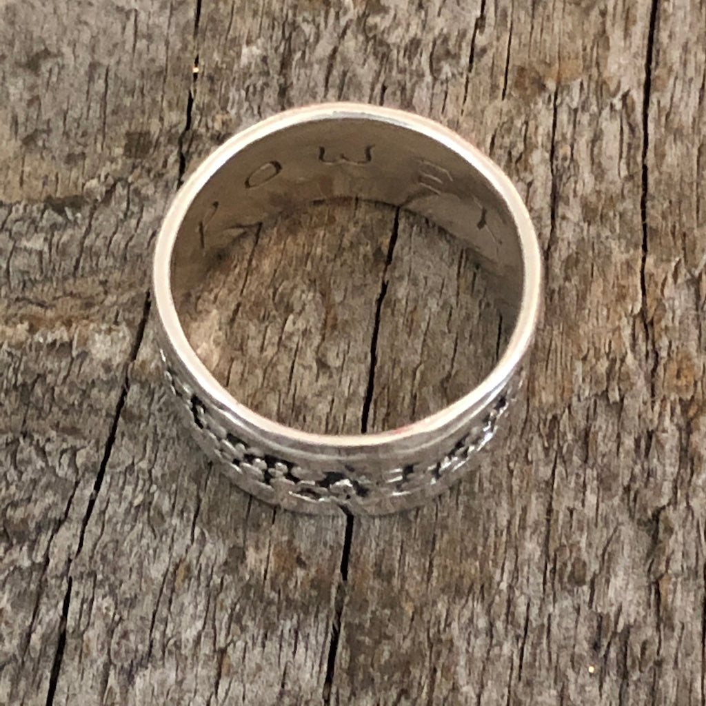 Wide silver band with pebble texture